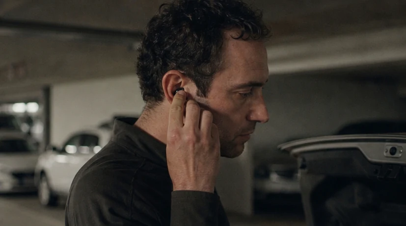 Putting in an earbud after a difficult call